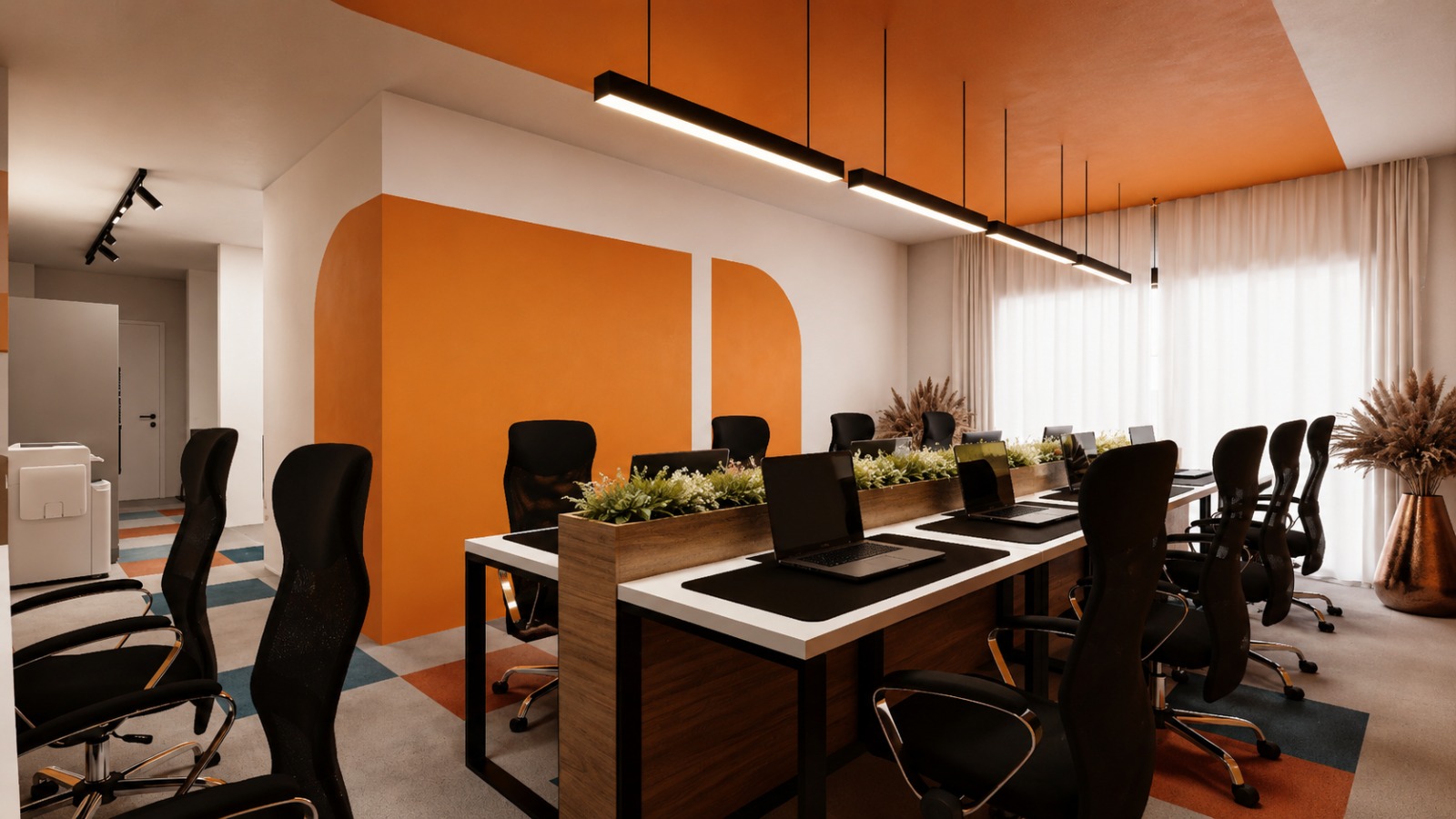 Open coworking desks at PRN CO-WORK with natural light and planters